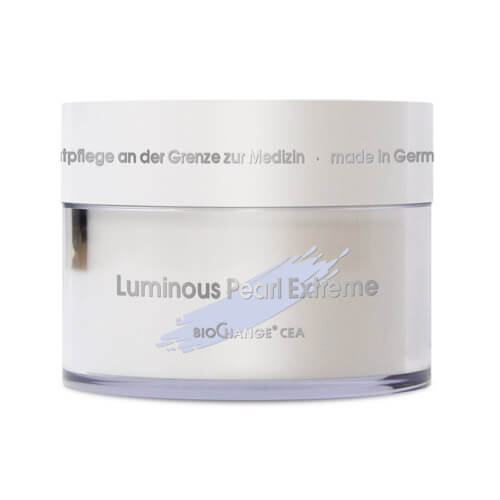 A white jar of Luminous Pearl Extreme, an advanced anti-aging cream, features silver accents and German text on the lid, displayed against a plain background.