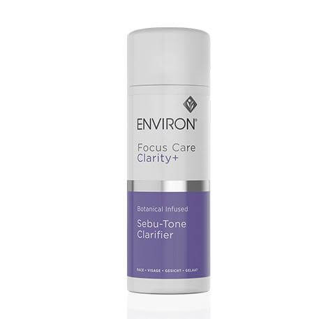 A bottle of Botanical Infused Sebu-Tone Clarifier with a gray cap and purple label stands upright on a white background—a clarifying toner with sebum-regulating exfoliators for clearer skin.