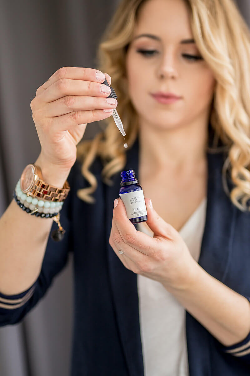 Women with Forlle'd Product and dropper