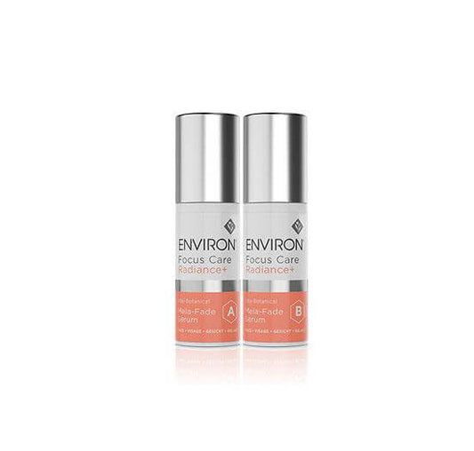 Two bottles of Vita-Botanical Mela-Fade Serum System, with silver caps and coral labels, stand side by side on a white background—an ideal serum duo for targeting discoloration with vitamins and botanical ingredients.