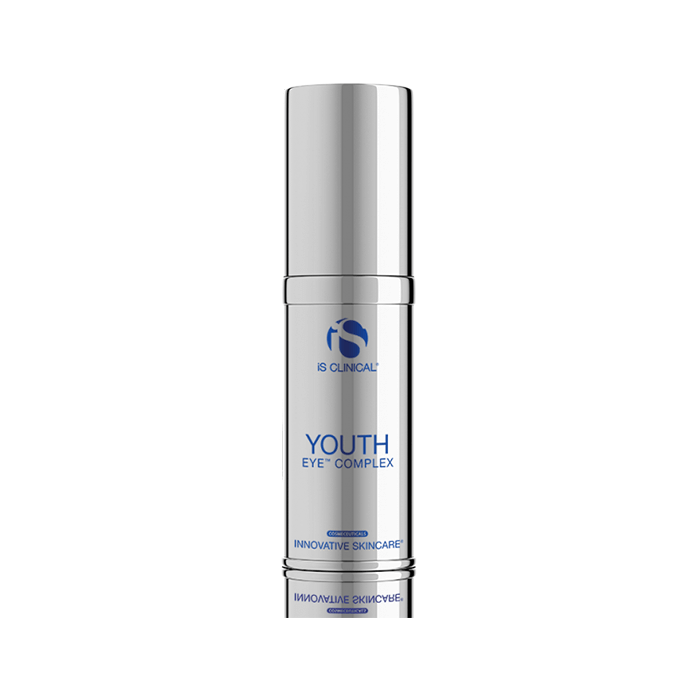 A silver bottle of iS Clinical Youth Eye Complex with blue text and logo stands upright against a white background. This eye treatment uses powerful peptides and advanced technologies to promote youthful-looking eyes.