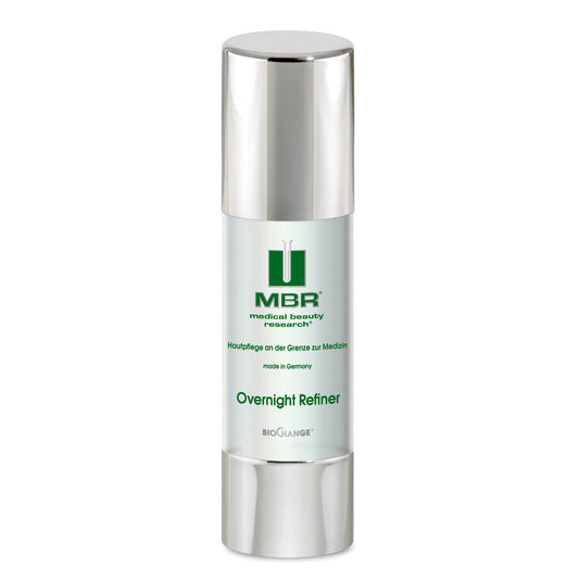 A silver and white 1.7 oz bottle of Overnight Refiner stands upright on a white background, featuring a pump dispenser. This MBR product supports cell regeneration and boosts your follow-up skincare products’ effects.