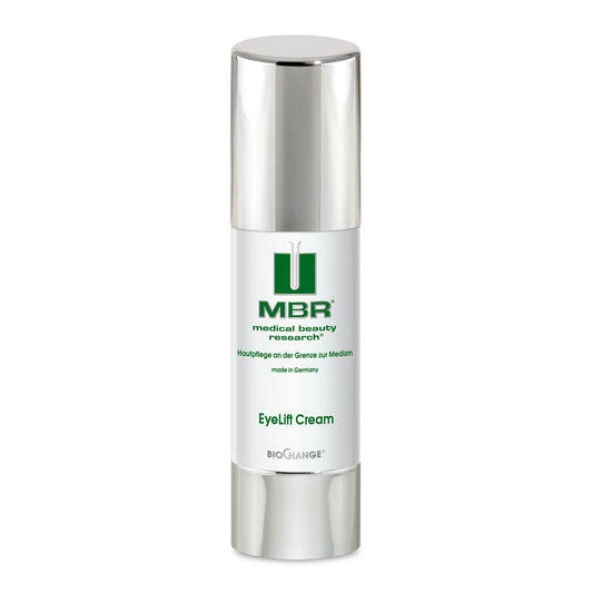 A sleek, cylindrical silver and white bottle labeled Eyelift Cream sits elegantly against a white background. This German-made formula reduces lines and wrinkles, with green and black text and a silver cap.