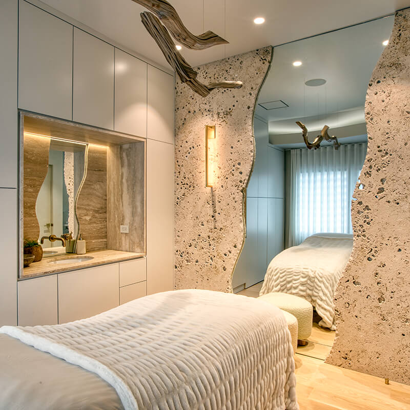 Microdermabrasion Treatment. Image of treatment room with natural aesthetic of stone and wood.