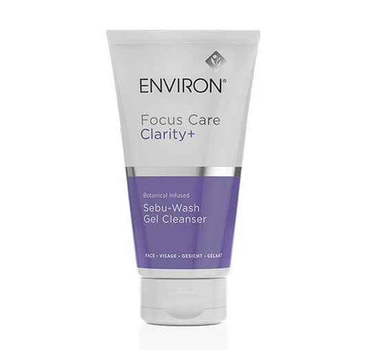 A tube of Botanical Infused Sebu-Wash Gel Cleanser, a foaming face wash with Salicylic Acid, featuring a white and purple design with black and purple text on the front.