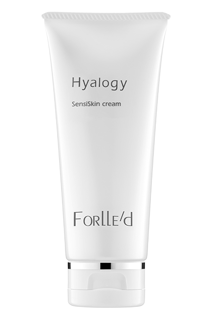 A white tube of Hyalogy SensiSkin cream with silver accents stands upright against a light background, highlighting its gentle, skin barrier-supporting formula suitable for sensitive skin.