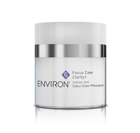 A white and silver jar labeled “Hydroxy Acid Sebu-Clear Masque,” an exfoliating mask for breakouts, is shown against a white background.