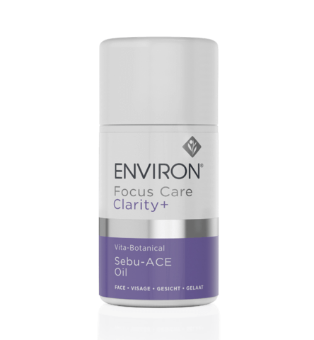 A white and purple bottle of Vita-Botanical Sebu-ACE Oil for facial use, formulated with skin vitamins to help control blemishes, stands upright against a plain white background.