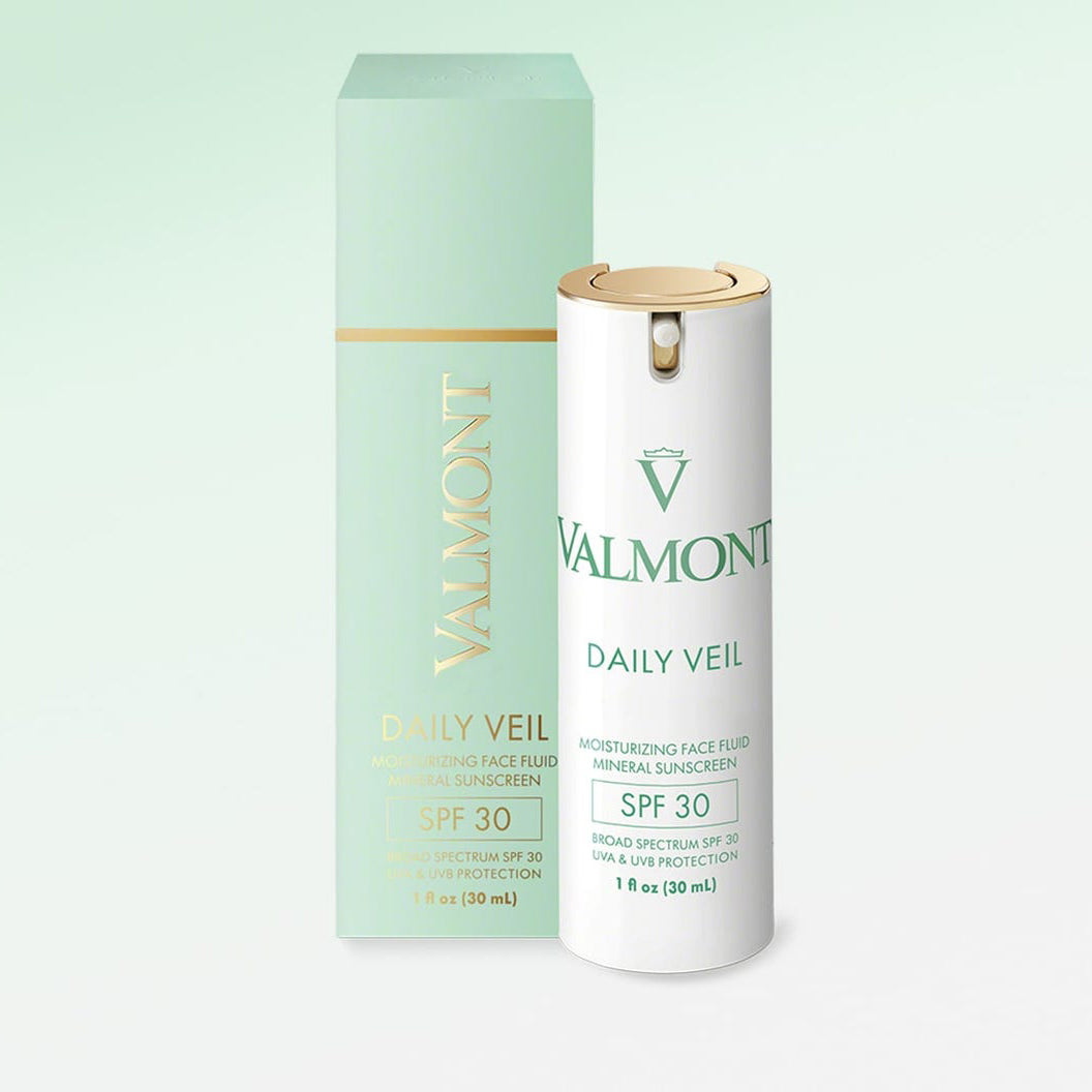 Vital Daily Veil SPF30 offers broad spectrum SPF30 UVA/UVB protection; comes in a white and gold bottle with a matching mint green and gold box, both showcasing product details and branding.