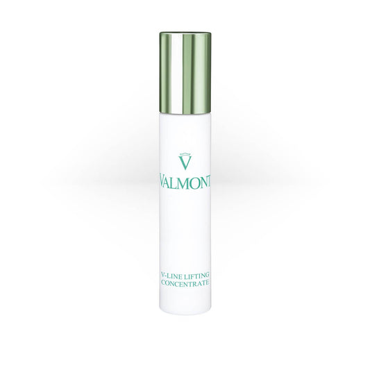 Valmont V-Line Lifting Concentrate in a sleek white bottle with a metallic green cap and green logo text.