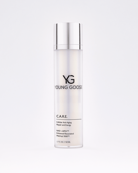 A sleek, cylindrical bottle of C.A.R.E. moisturizer with a silver cap. The label highlights anti-aging, repair, energy benefits, and reduced fine lines. Contains 1.7 fl oz (50 ml). Set against a plain white background.