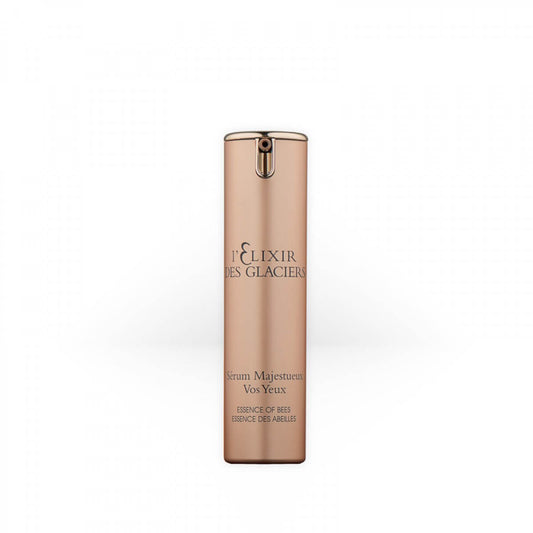 Elixir des Glaciers Sérum Majestueux Vos Yeux in a frosted glass bottle with a gold cap, a luxurious lifting eye serum targeting wrinkles, puffiness, and dark circles.