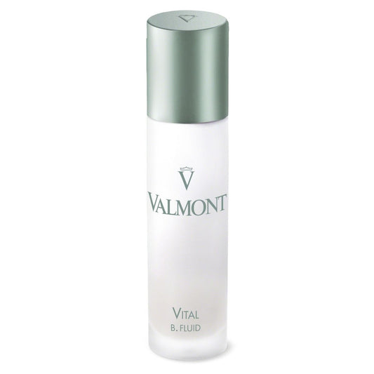 A VALMONT VITAL B. Fluid bottle with a frosted finish, metallic silver cap, and silver lettering stands upright against a white background.